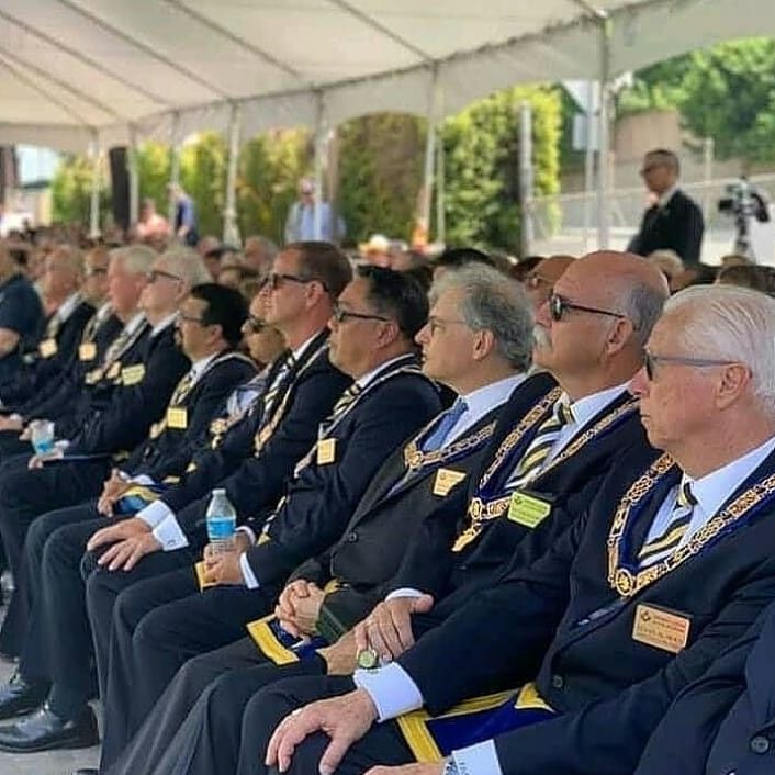 Full assembly of lodge members in formal regalia
