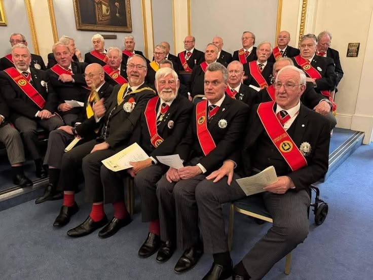 Lodge officers gathered for a formal address in the lodge room