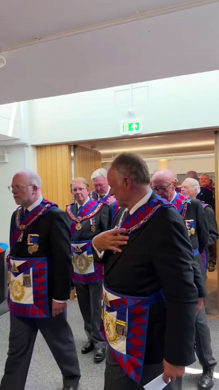 Procession of lodge members entering the temple